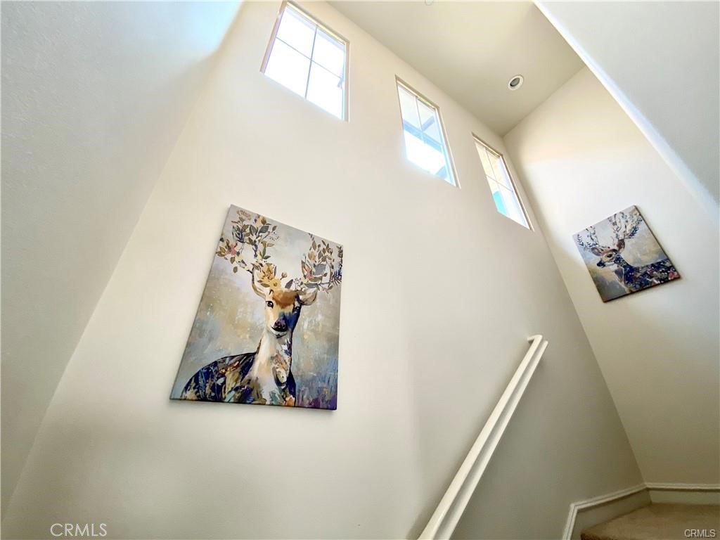 62 Emerald Clover Irvine, CA 92620 - Photo 10 of 15 a view of a hallway with stairs