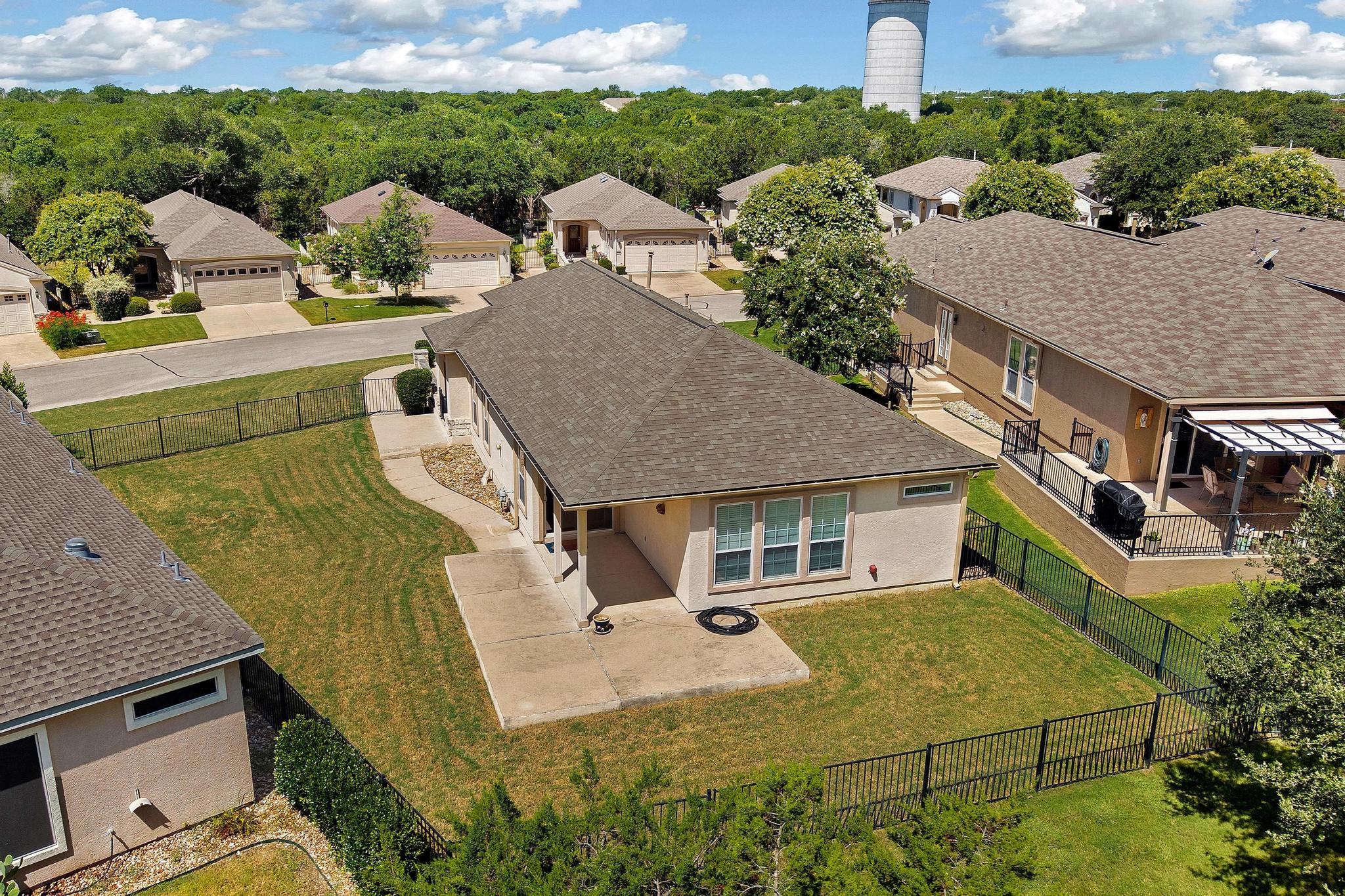 520 Mill Pond Path Georgetown, TX 78633 - Photo 34 of 38 Overlooking a tranquil neighborhood, this property offers a generous yard and an inviting rear patio.