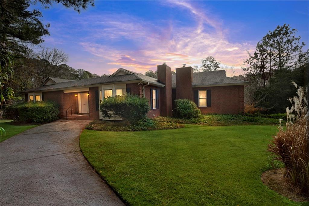 2188 Upper Burris Road Canton, GA 30114 - Photo 1 of 1 front view of a house with a garden