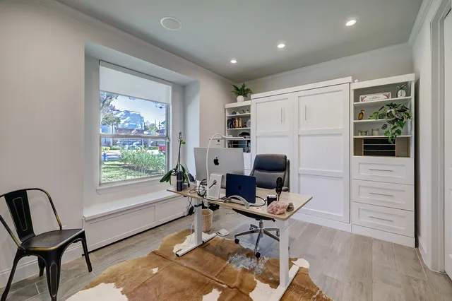 a work room with furniture and a window