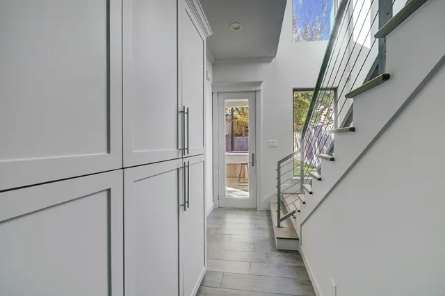 a view of entryway with stairs and wooden floor