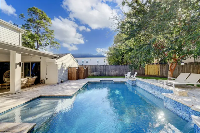 a view of a back yard of the house