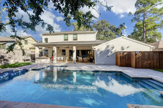 a view of a house with swimming pool