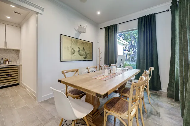 a view of a dining room with furniture window and outside view