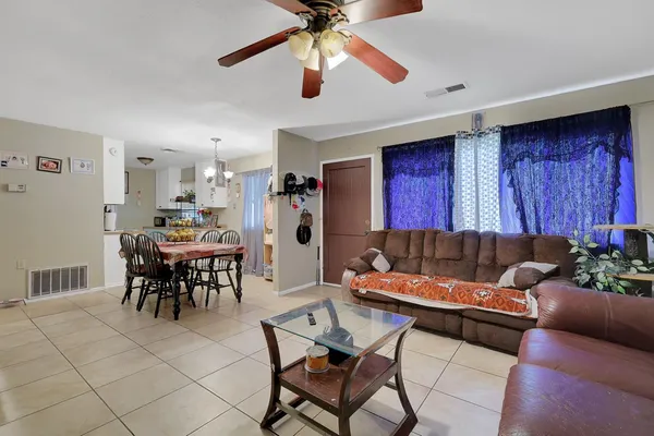a dining room with furniture and window