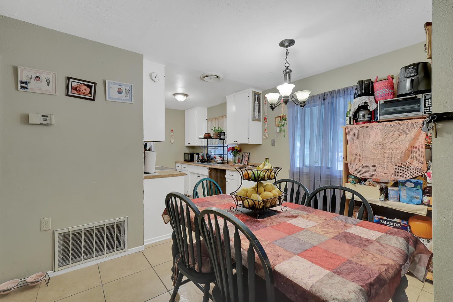 3132 4th Street Biggs, CA 95917 - Photo 13 of 21 a dining room with furniture and window