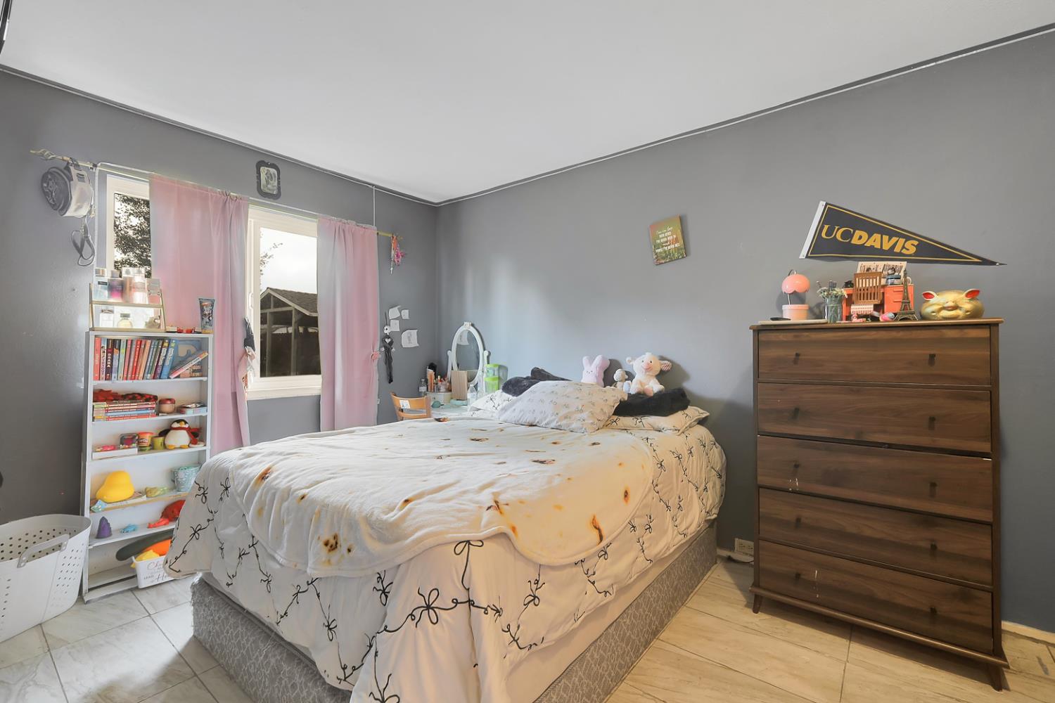 3132 4th Street Biggs, CA 95917 - Photo 17 of 21 a bedroom with a bed and wooden floor