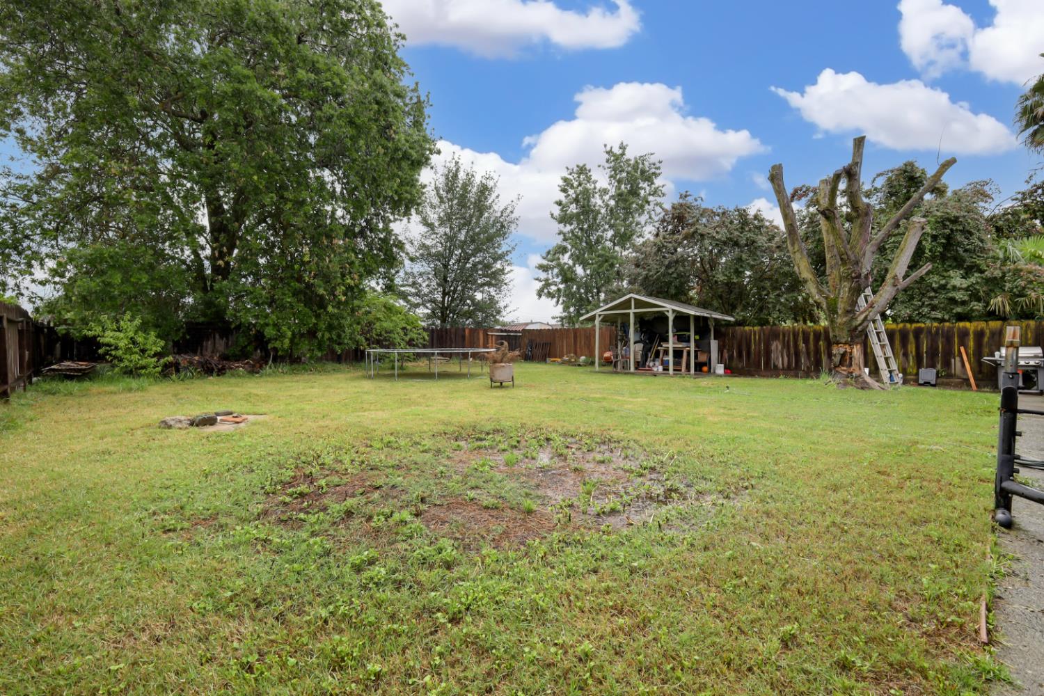 3132 4th Street Biggs, CA 95917 - Photo 5 of 21 a view of a house with a backyard