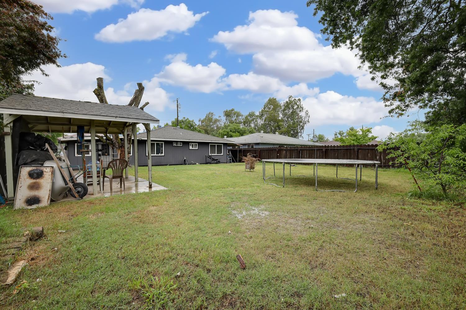 3132 4th Street Biggs, CA 95917 - Photo 7 of 21 a view of a swimming pool with a patio