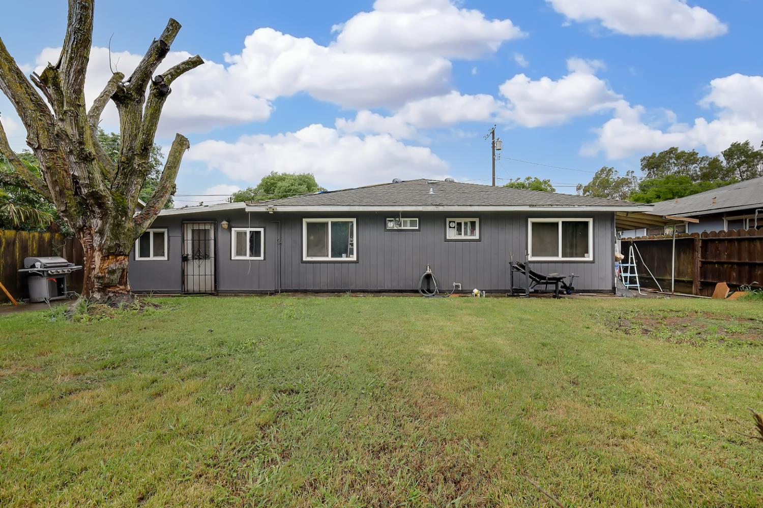 3132 4th Street Biggs, CA 95917 - Photo 9 of 21 a view of a house with a backyard