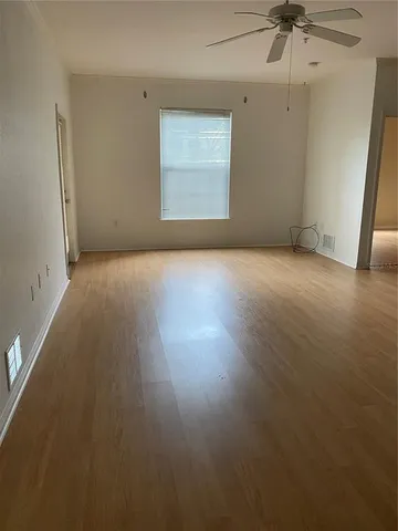 an empty room with a empty space and a window