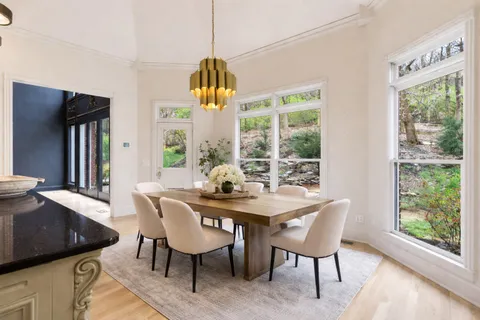 a view of wooden floor and windows in a room