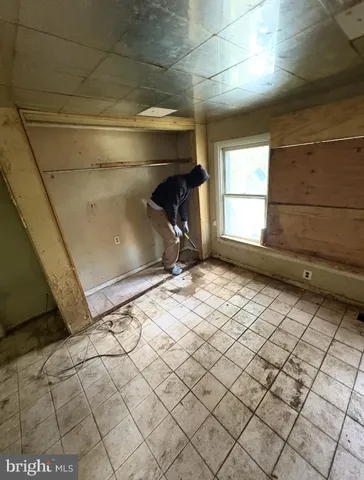 a view of an empty room with windows