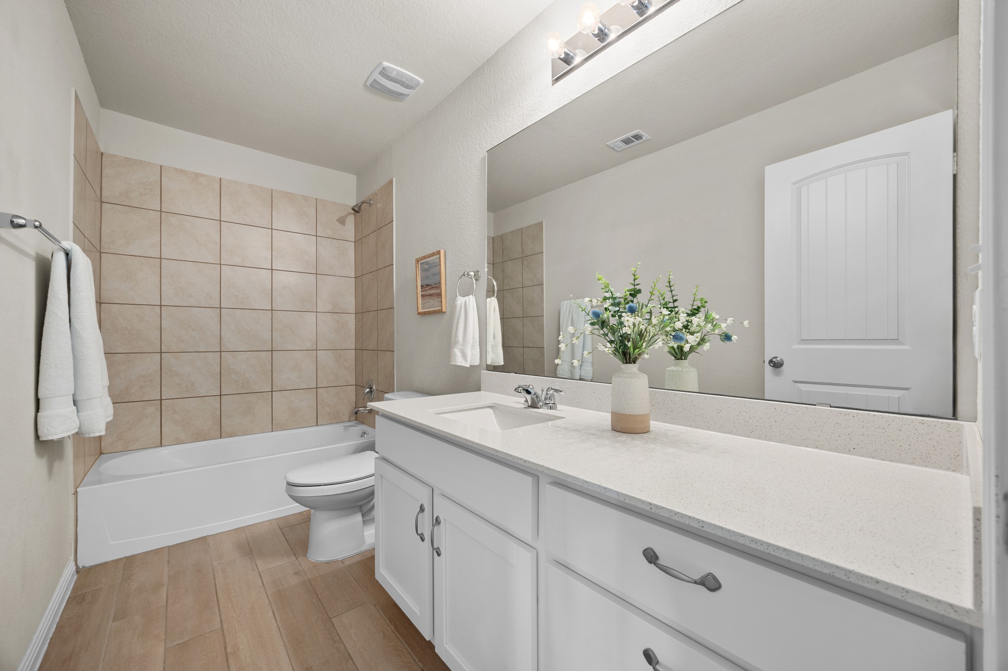 2413 Starhill Ranch Street Georgetown, TX 78628 - Photo 29 of 40 a bathroom with a sink a toilet and shower