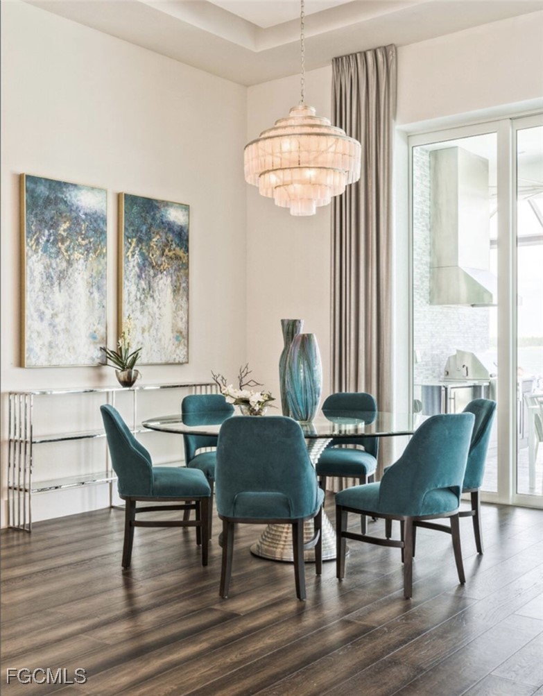 19053 WildBlue Boulevard Fort Myers, FL 33913 - Photo 8 of 50 a view of a dining room with furniture window and wooden floor