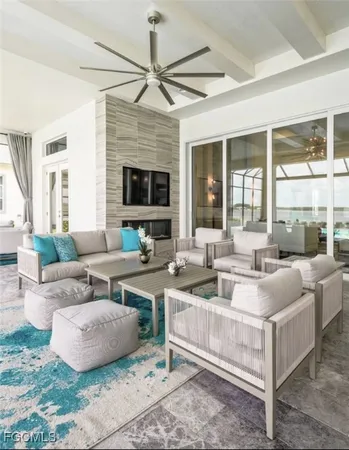 a living room with fireplace furniture and a flat screen tv