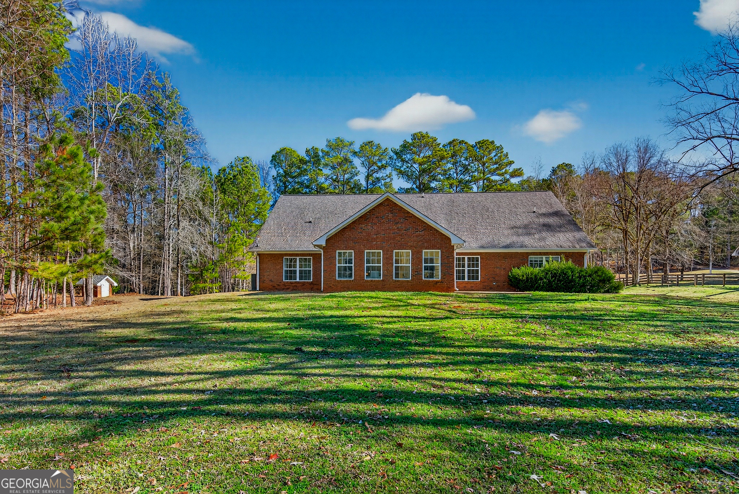 830 John Lovelace Road LaGrange, GA 30241 - Photo 41 of 44 a front view of a house with a yard table and chairs