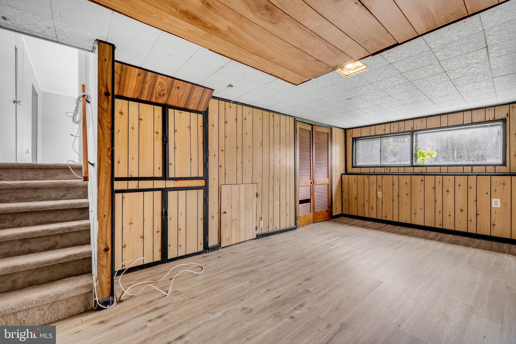 136 Brookside Boulevard Newark, DE 19713 - Photo 17 of 31 a view of an empty room with wooden floor and a window