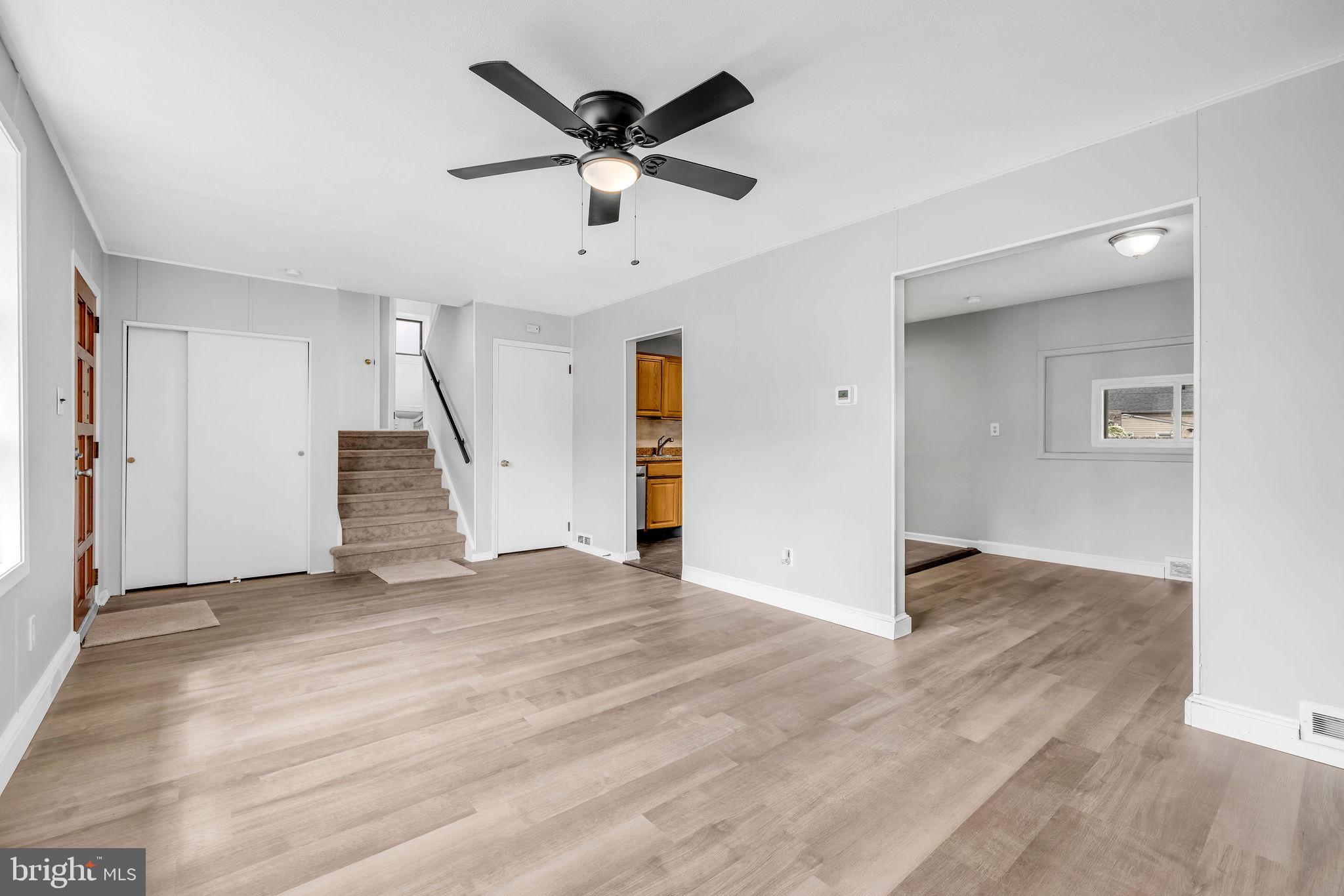 136 Brookside Boulevard Newark, DE 19713 - Photo 2 of 31 wooden floor in an empty room with a ceiling fan