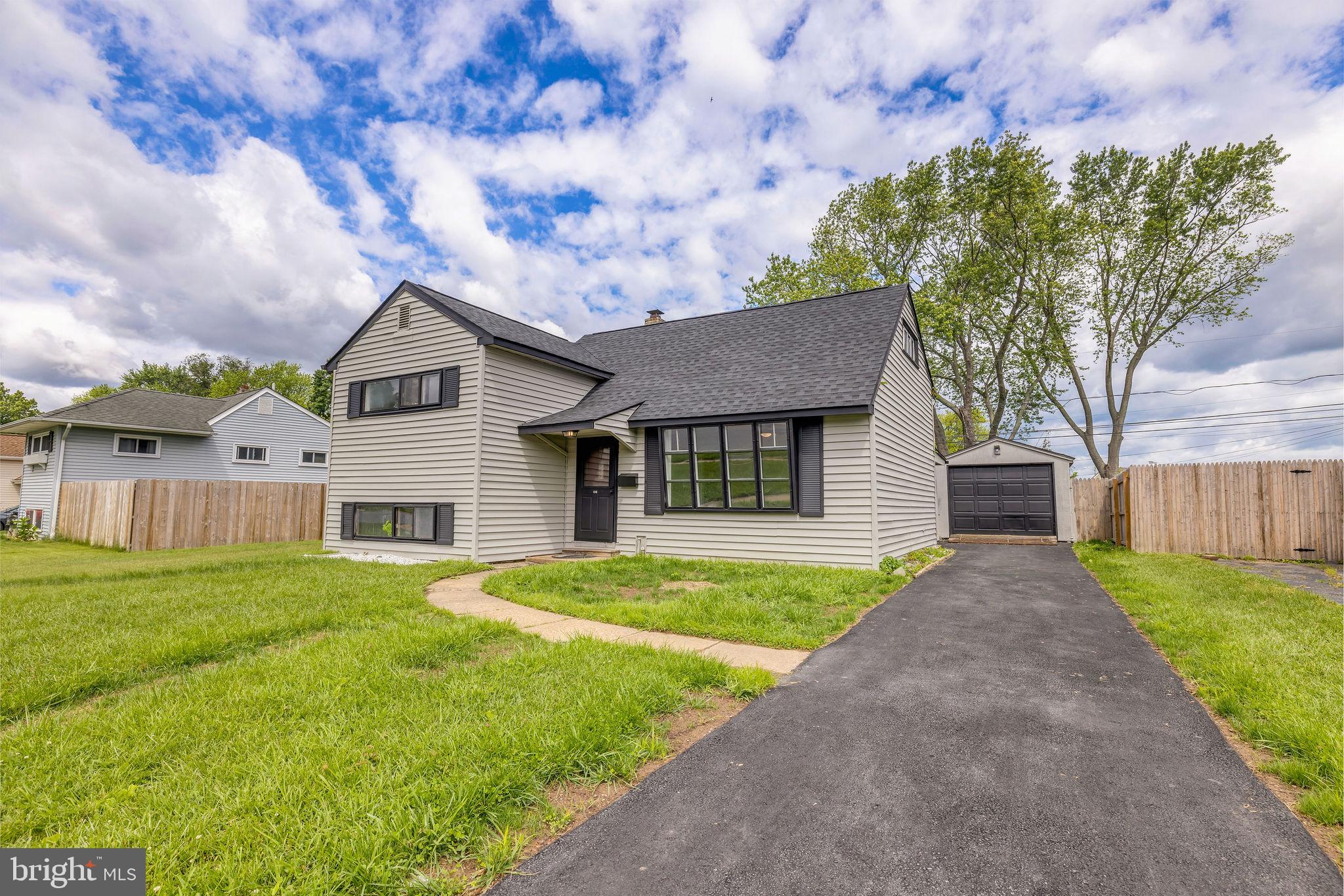 136 Brookside Boulevard Newark, DE 19713 - Photo 23 of 31 a front view of a house with a yard and garage