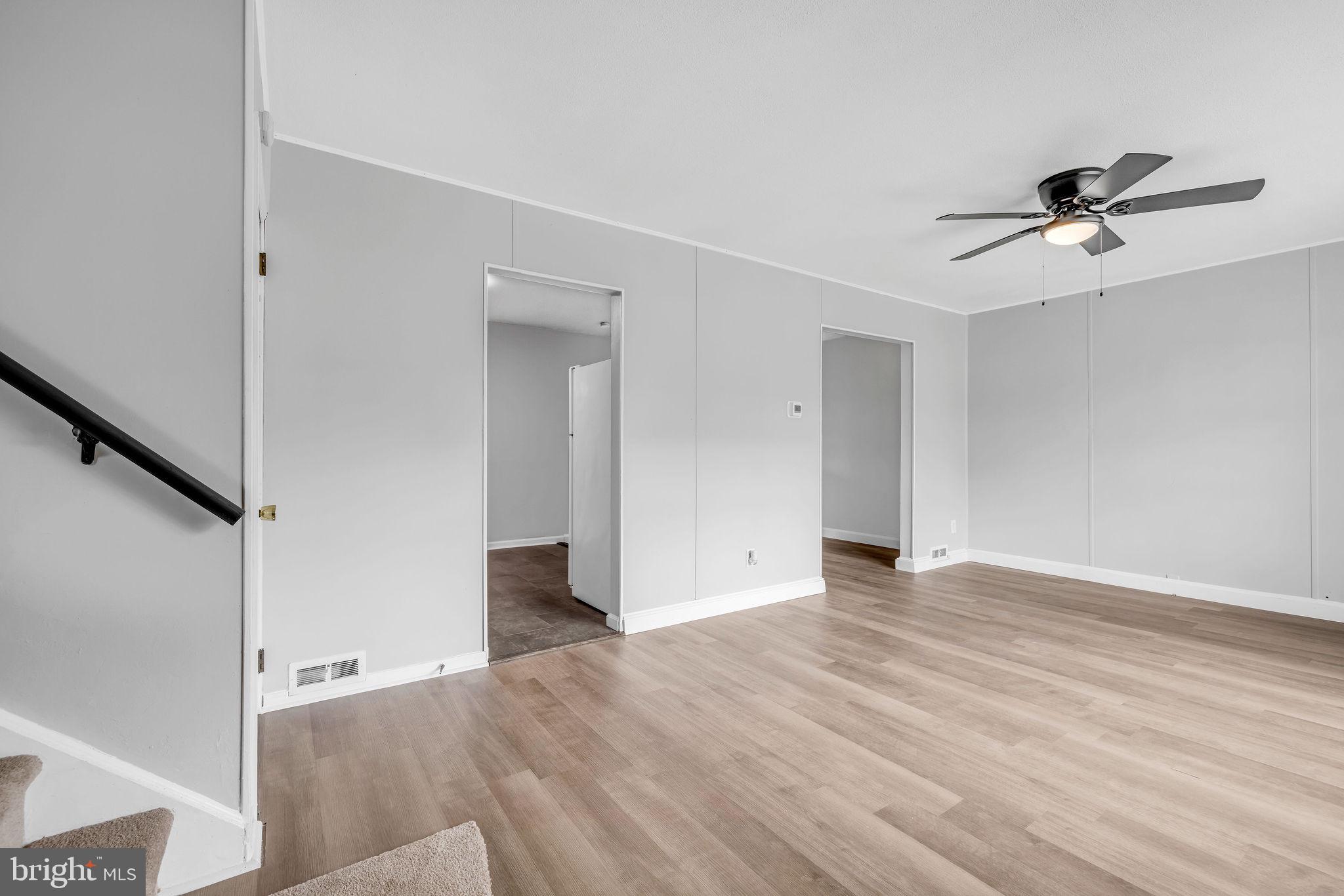 136 Brookside Boulevard Newark, DE 19713 - Photo 4 of 31 a view of empty room with wooden floor and fan