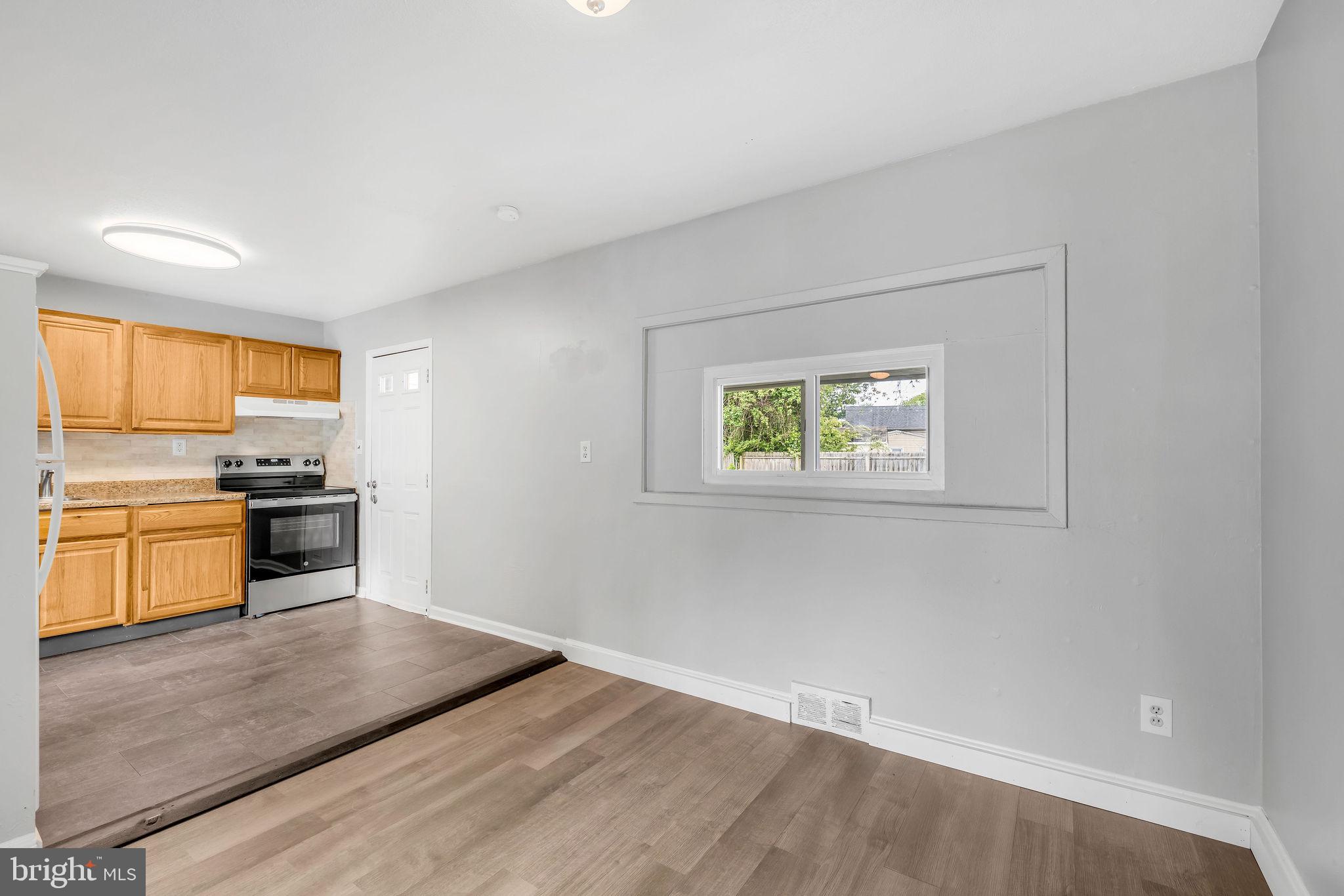 136 Brookside Boulevard Newark, DE 19713 - Photo 5 of 31 a kitchen with stainless steel appliances a refrigerator and a stove top oven