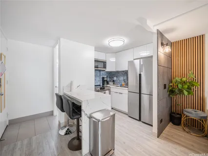 a kitchen with a refrigerator a sink and dishwasher