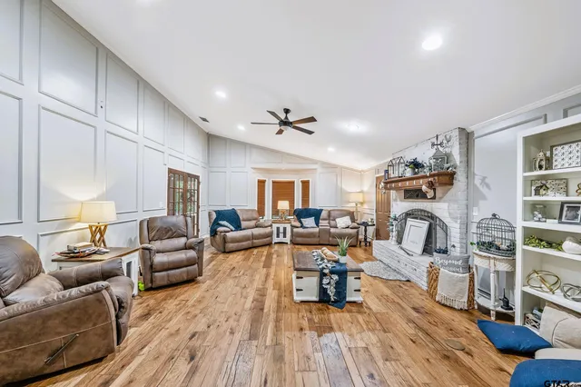 a living room with furniture or couch and a wooden floor