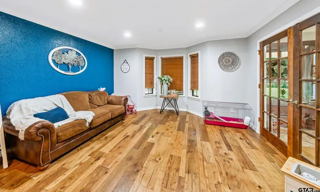 a living room with a couch and dresser