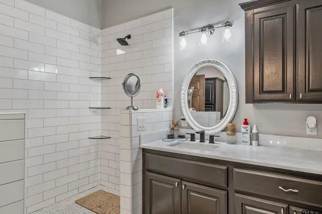 a bathroom with a sink and a mirror