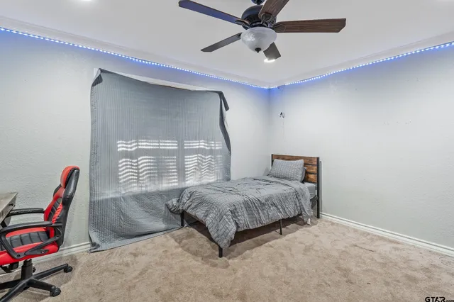 a living room with furniture a air conditioner vent and a window