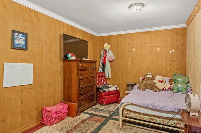 a bedroom with furniture and a fireplace