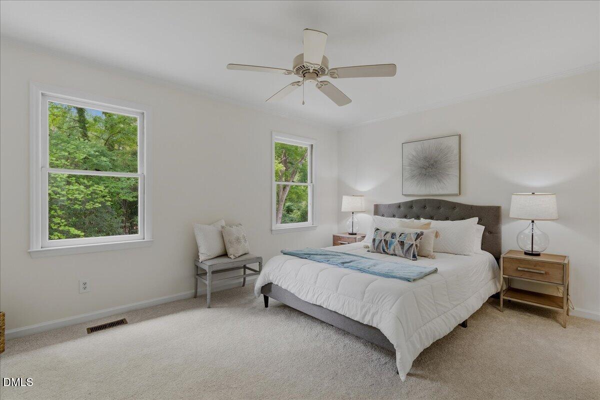 2834 Wayland Drive Raleigh, NC 27608 - Photo 13 of 26 a bedroom with a bed and window