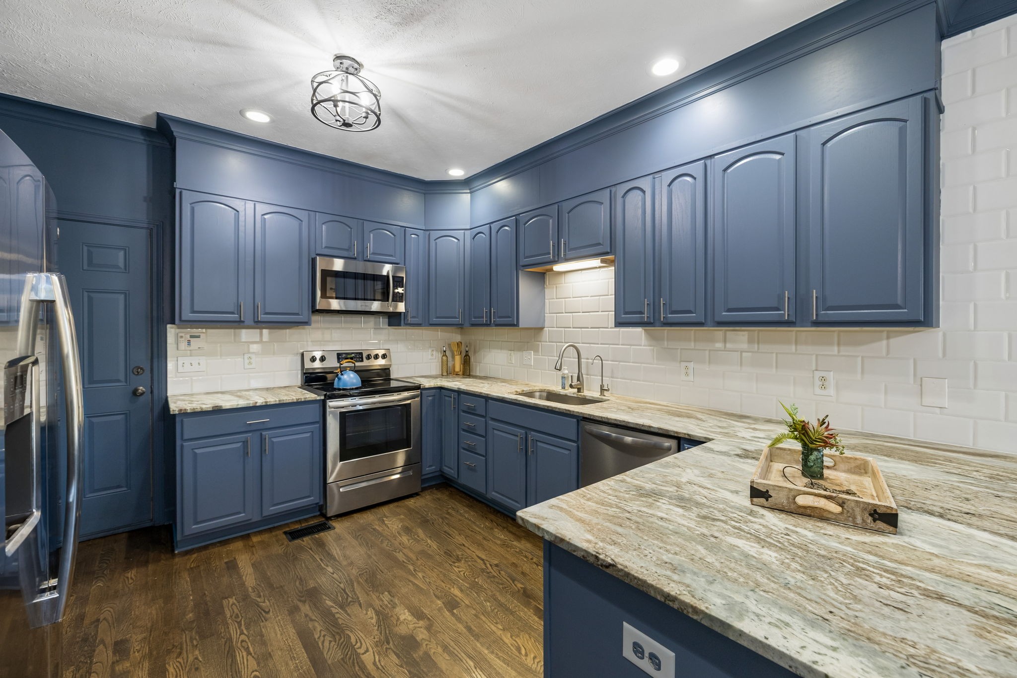 3918 Rowland Road Murfreesboro, TN 37128 - Photo 12 of 50 a kitchen with sink cabinets and stainless steel appliances