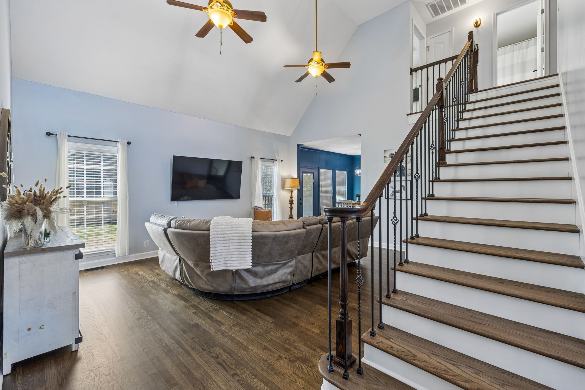 3918 Rowland Road Murfreesboro, TN 37128 - Photo 9 of 50 wooden floor living room with furniture and flat screen tv