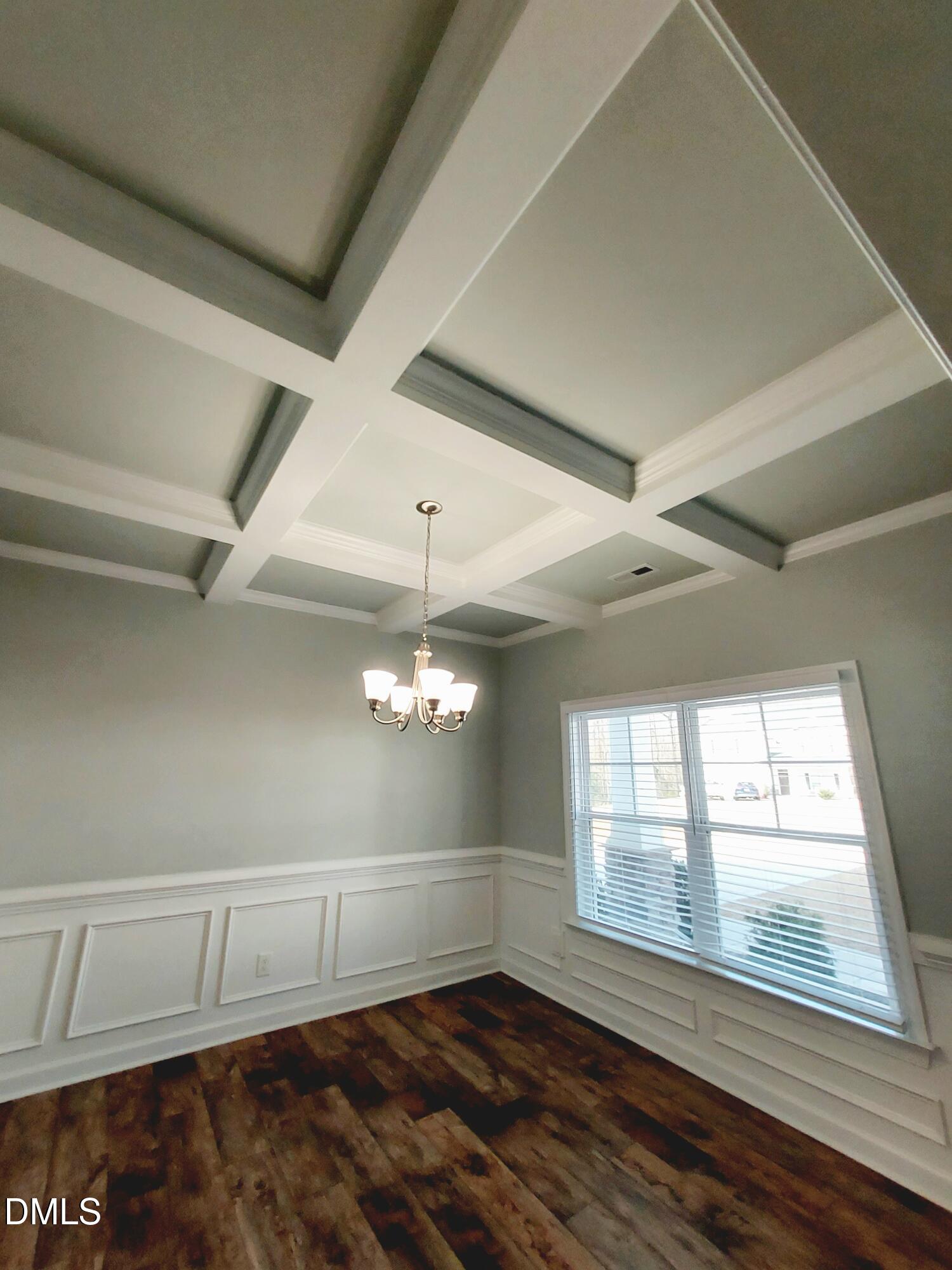 255 Kenbridge Lane Princeton, NC 27569 - Photo 36 of 98 a view of an empty room with wooden floor and a window