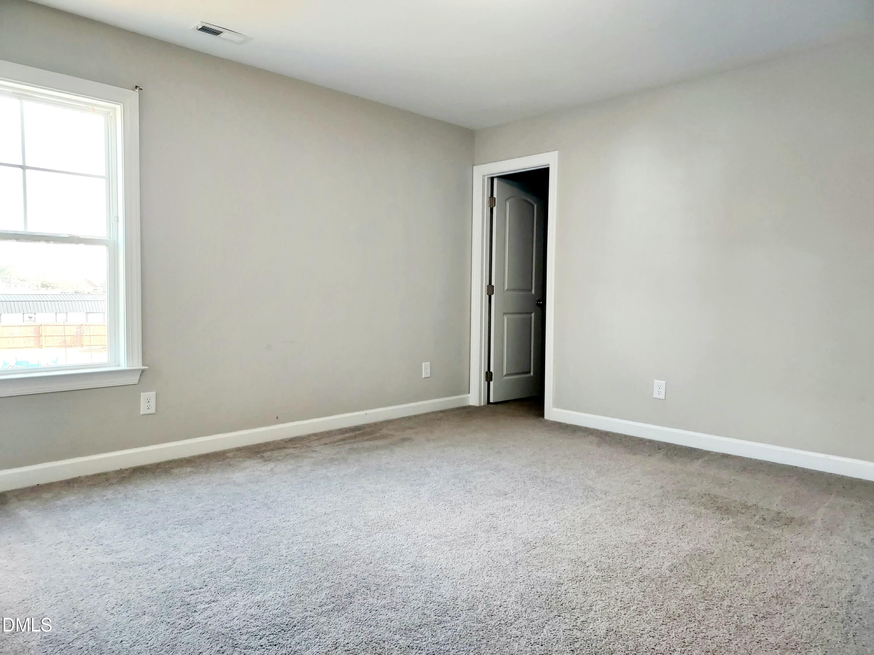 255 Kenbridge Lane Princeton, NC 27569 - Photo 51 of 98 an empty room with windows and closet