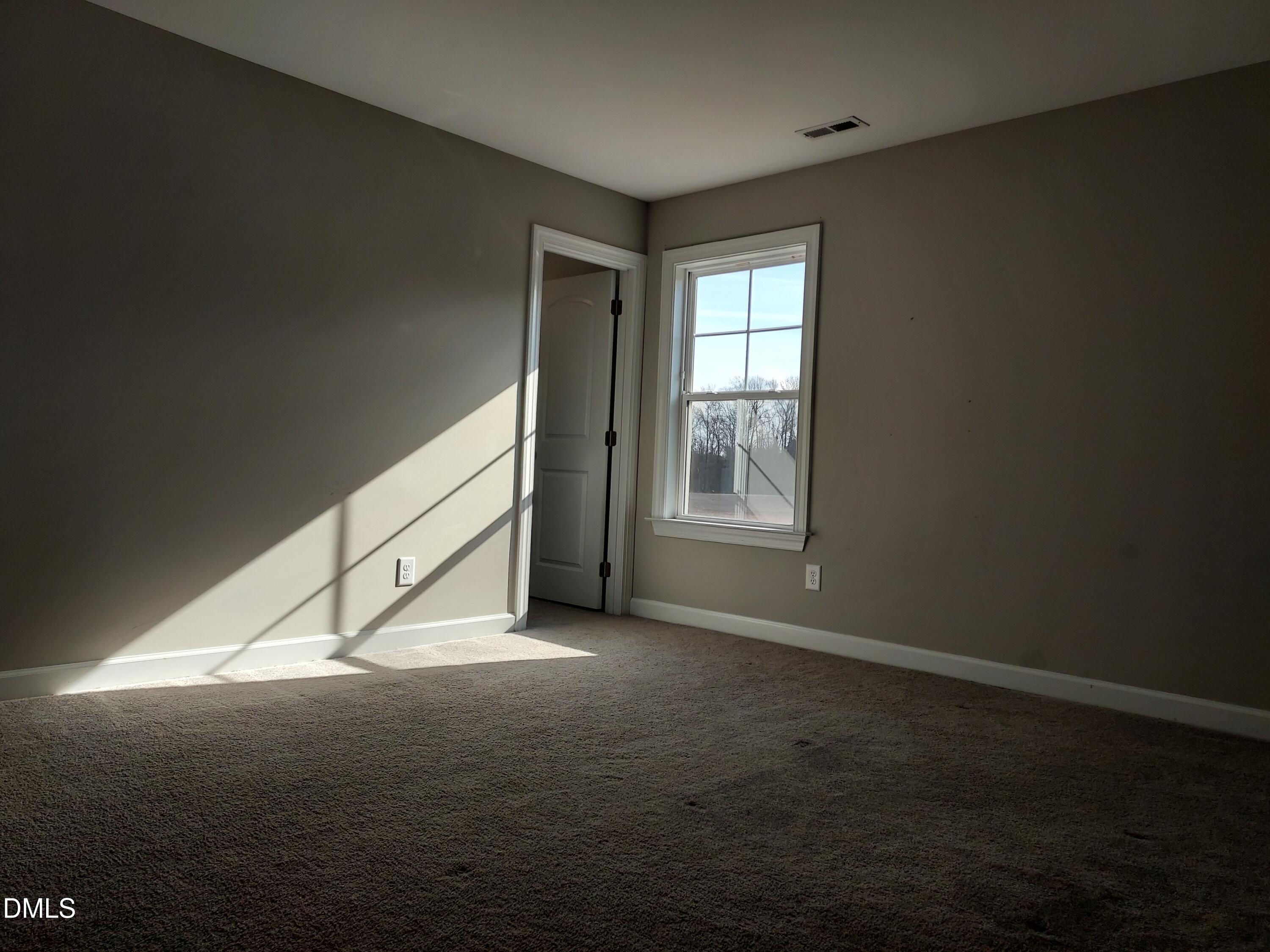 255 Kenbridge Lane Princeton, NC 27569 - Photo 55 of 98 a view of an empty room with a window