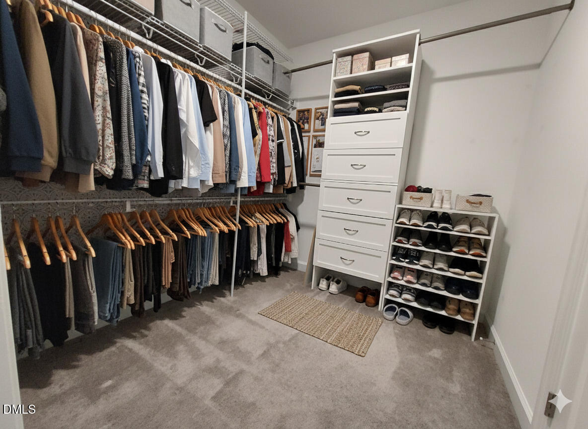 255 Kenbridge Lane Princeton, NC 27569 - Photo 65 of 98 a view of walk in closet with clothes and shoes
