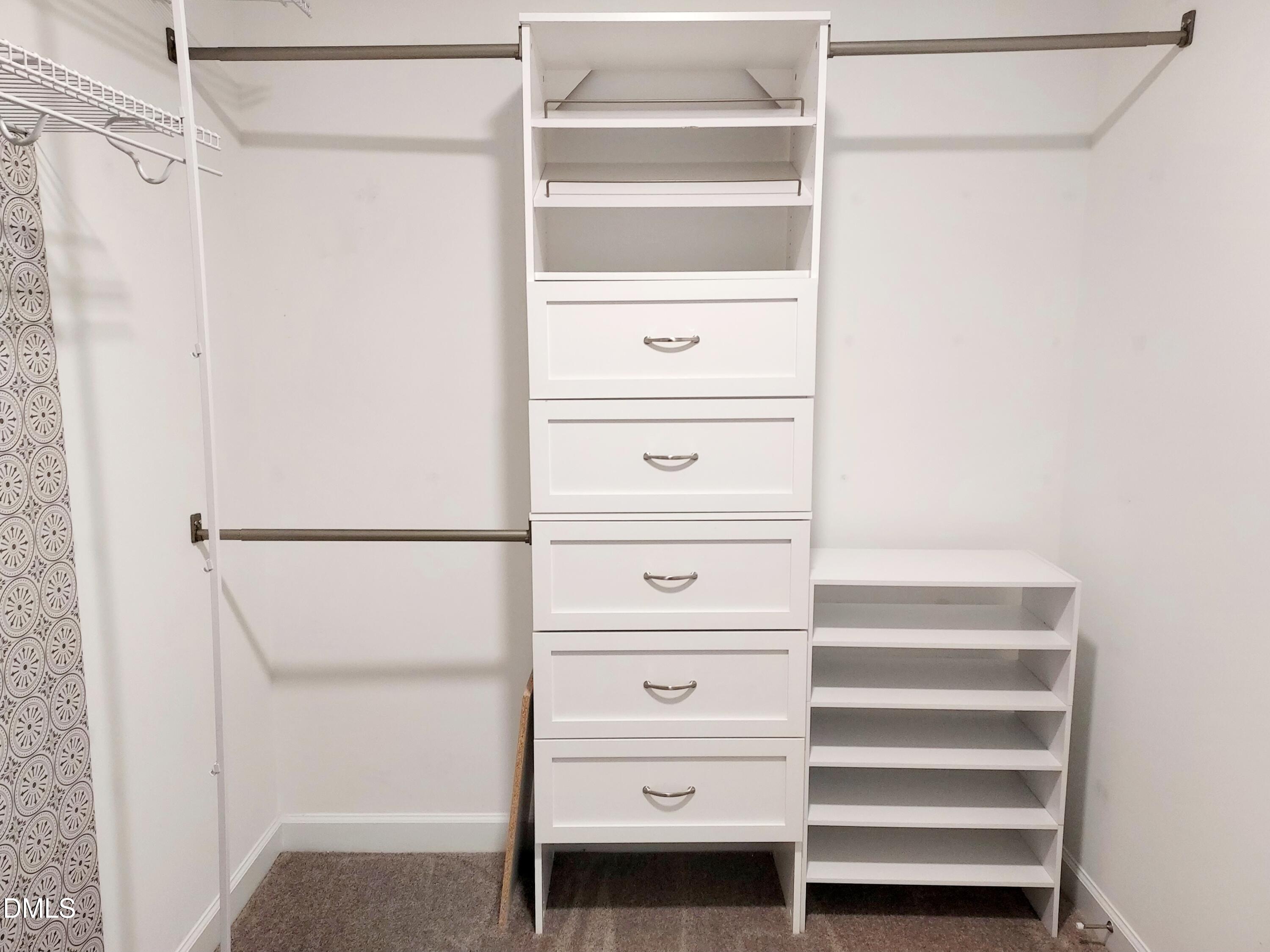 255 Kenbridge Lane Princeton, NC 27569 - Photo 68 of 98 a view of walk in closet with empty racks