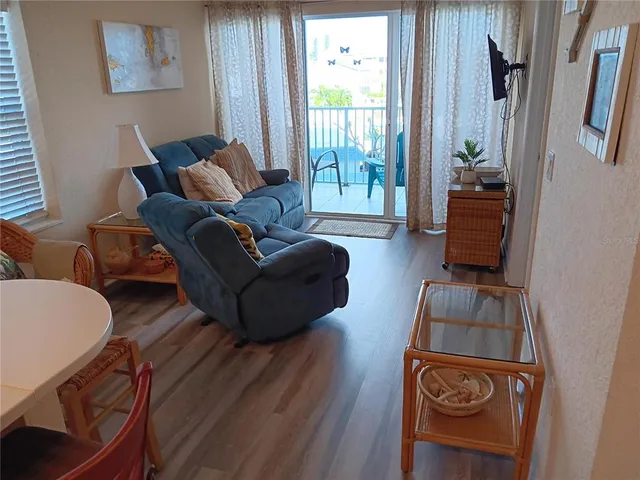 a bedroom with a bed and a night stand