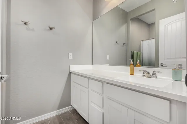 a bathroom with a sink and a mirror