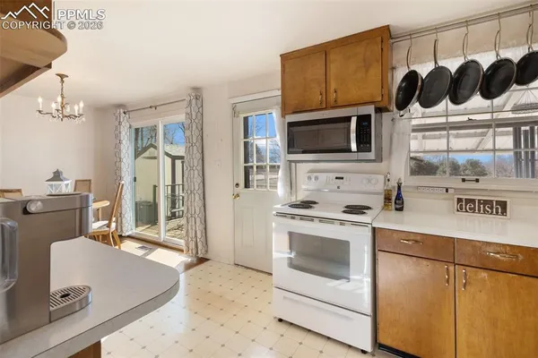 a kitchen with a stove a sink and a microwave