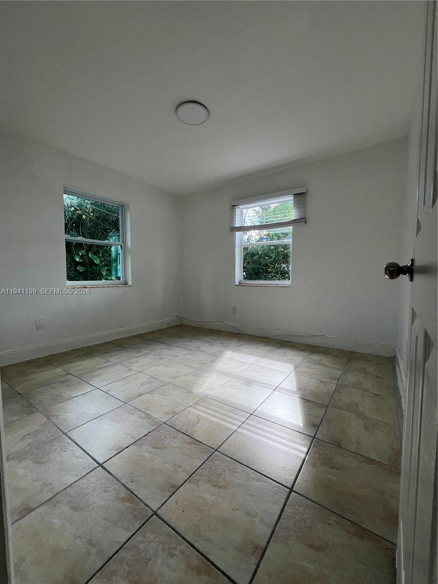 15400 Southwest 295th Street Homestead, FL 33033 - Photo 17 of 38 an empty room with windows