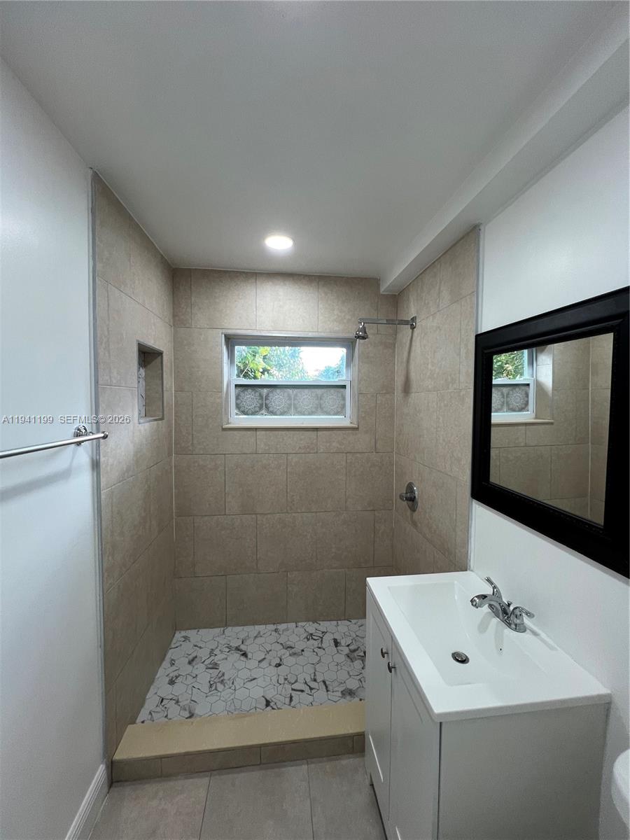 15400 Southwest 295th Street Homestead, FL 33033 - Photo 20 of 38 a bathroom with a sink a toilet and mirror