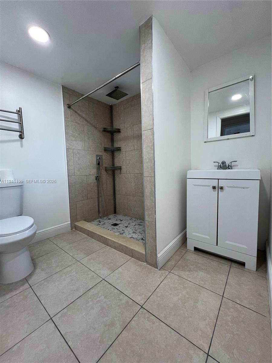 15400 Southwest 295th Street Homestead, FL 33033 - Photo 24 of 38 a bathroom with a toilet sink and shower