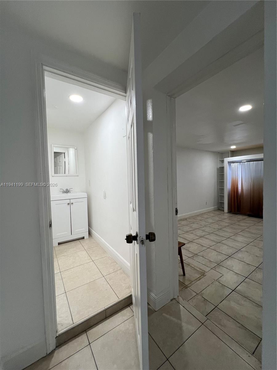 15400 Southwest 295th Street Homestead, FL 33033 - Photo 25 of 38 a bathroom with a sink and a mirror