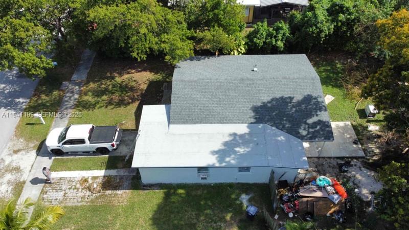 15400 Southwest 295th Street Homestead, FL 33033 - Photo 5 of 38 an aerial view of a house with a garden and swimming pool