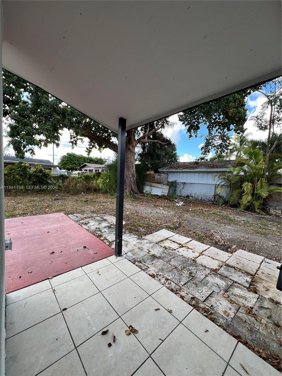 15400 Southwest 295th Street Homestead, FL 33033 - Photo 8 of 38 a view of a yard with plants and a fountain