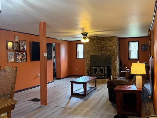 a living room with furniture and a fireplace
